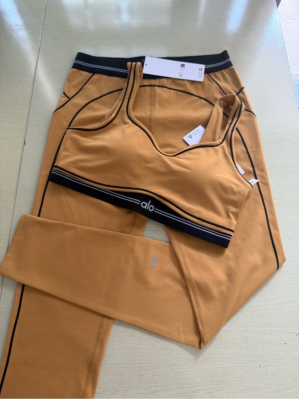 ALO Yoga Tan Sports Bra and Leggings Set with Black Trim